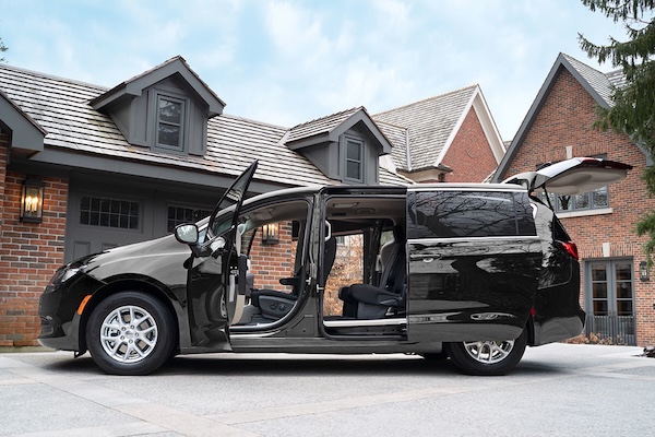 A 2025 Chrysler Grand Caravan parked with all its doors open.